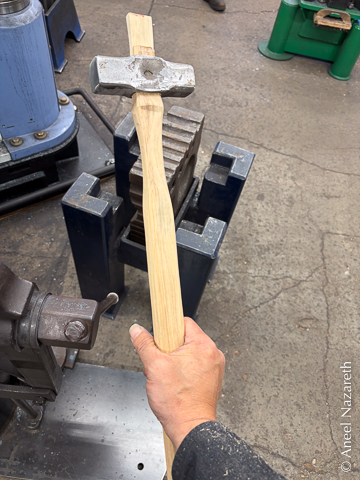A hickory handle in the unhardened hammer head